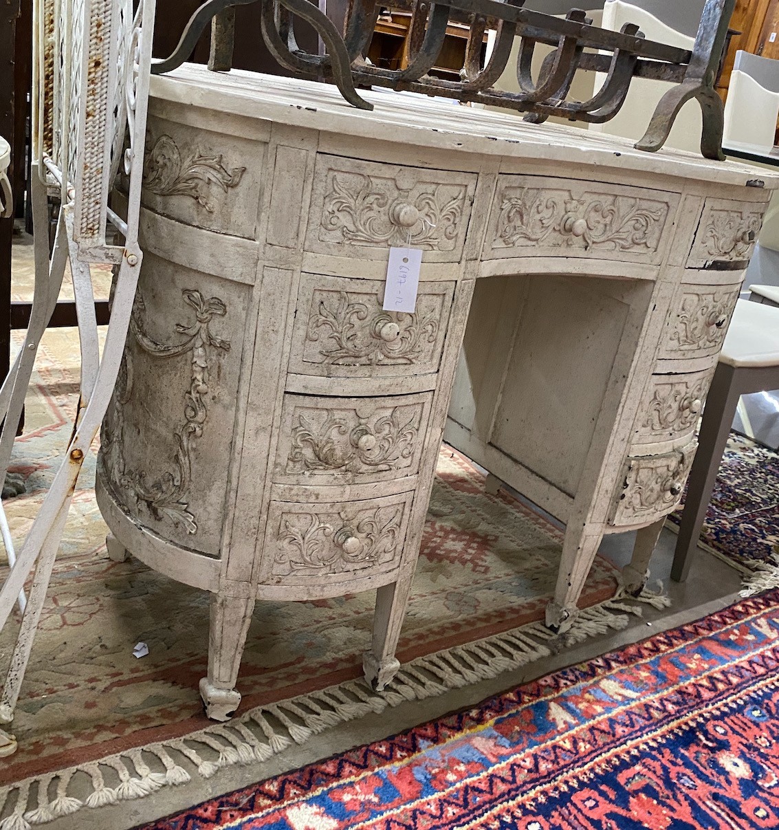 A 20th century white painted carved walnut kidney shaped dressing table, width 107cm, depth 60cm, height 77cm